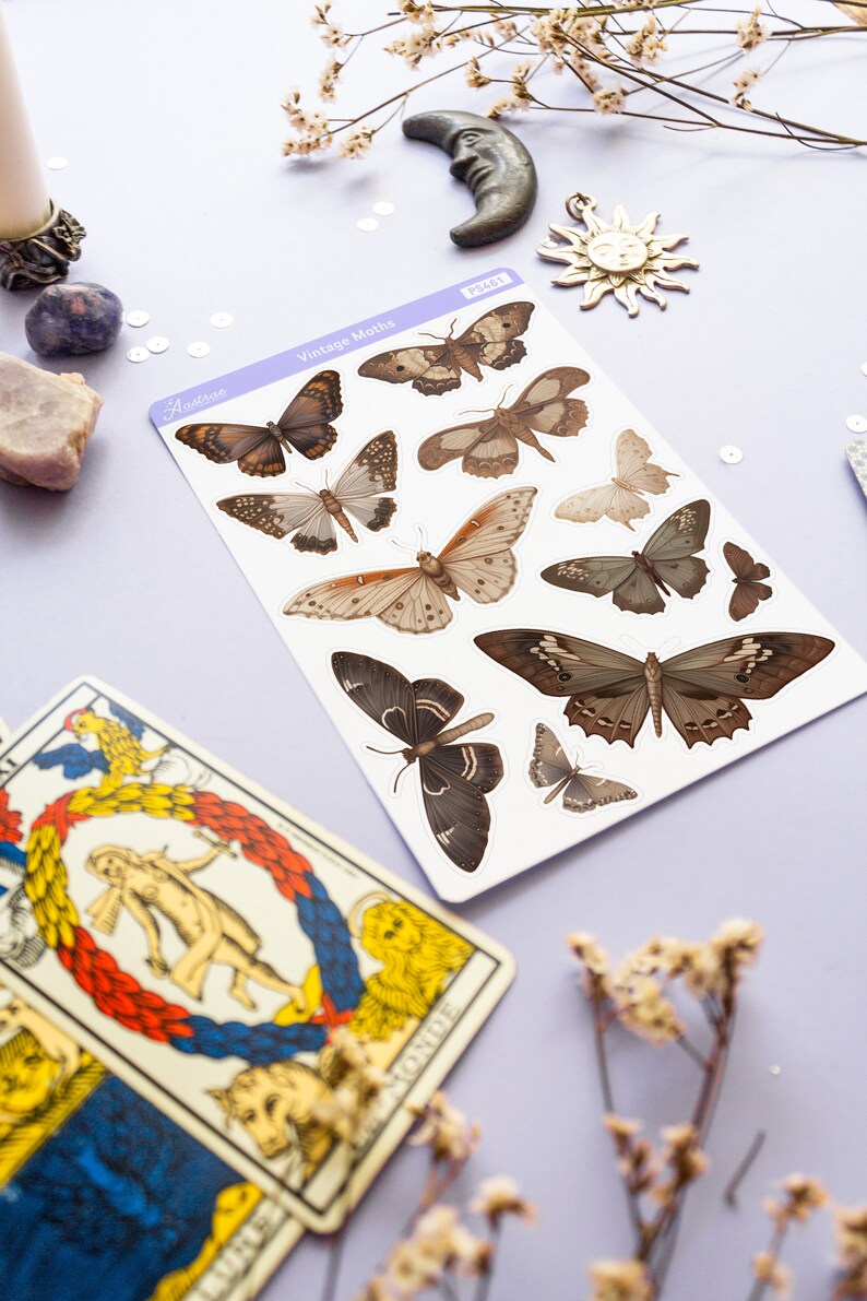 May include: A sheet of vintage moth stickers with brown, black, and white moths on a white background. The sheet is labeled "Vintage Moths" and has the product number "PS461".