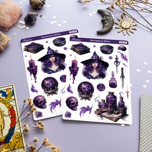 May include: Two sheets of stickers featuring a purple and black witch with a cauldron, skulls, potion bottles, and books. The stickers are labelled "Necromancy Witch" and "Astraea" with the product number "PS275".