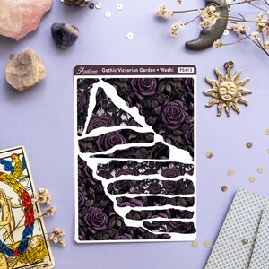 May include: A sheet of decorative washi tape with a gothic Victorian garden design. The tape features a dark background with purple roses and vines. The text "Gothic Victorian Garden - Washi" and "PS413" is printed on the sheet.