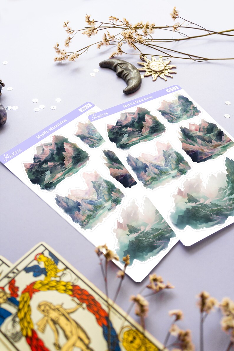 May include: A sheet of stickers featuring watercolor illustrations of misty mountains. The stickers are labeled "Mystic Mountains" and "Aestrea".
