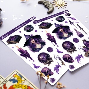 May include: A sheet of stickers featuring a purple and black necromancy witch with a cauldron, books, candles, skulls, and feathers. The stickers are labelled "Necromancy Witch" and "Aastroe PS215".