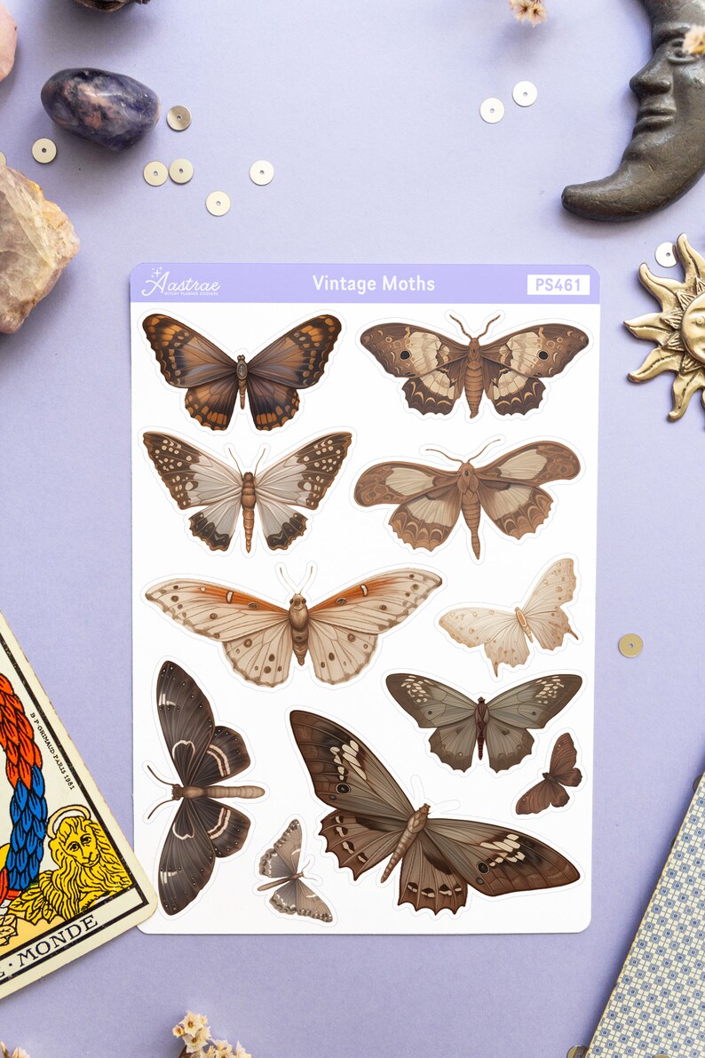 May include: A sheet of vintage moth stickers with a white background. The stickers feature various brown, black, and white moths with intricate wing patterns. The sheet is labeled "Vintage Moths" and "PS461".