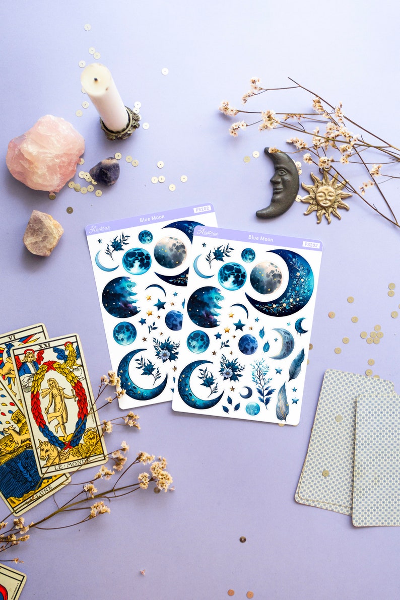 May include: Two sheets of blue moon themed stickers with gold accents. The stickers feature moons, stars, and floral designs. The sheets are labeled "Blue Moon" and "PS102".