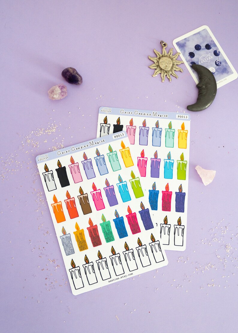 May include: Two sheets of colorful candle stickers with a white background. The stickers are arranged in rows and feature various colors and designs. The text "Color Candle Magic" and "PS013" are printed on the sheets.