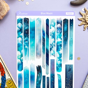 May include: A sheet of blue washi tape with a variety of designs, including clouds, stars, and galaxy patterns. The sheet is labeled "Blue Washi" and "PS231".