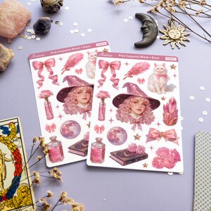 May include: Two sheets of pink and white stickers featuring a pink-haired witch with a white cat, a pink feather, a pink bow, a moon, a book, a bottle, and a crystal. The stickers are labeled "Pink Coquette Witch + Deco" and "P5553".