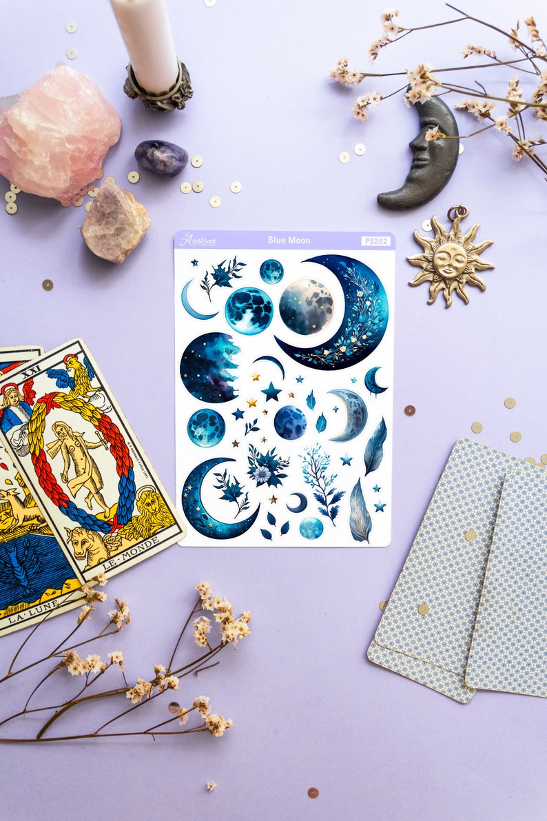 May include: A sheet of blue moon themed stickers with various crescent moons, full moons, stars, and floral designs. The sticker sheet is labeled "Blue Moon" and "PS202".
