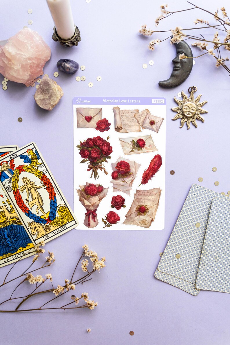 May include: A sheet of stickers featuring Victorian-style illustrations of roses, envelopes, and handwritten letters. The stickers are on a white background with a purple border and the text "Victorian Love Letters" in black.