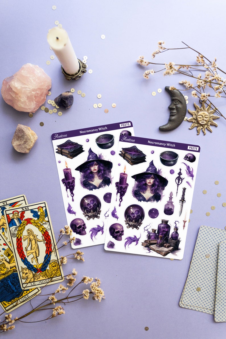 May include: Two sheets of stickers featuring a purple and black illustration of a witch with a cauldron, books, skulls, candles, and potion bottles. The stickers are labelled "Necromancy Witch" and "Astrae" with the product number "PS275".