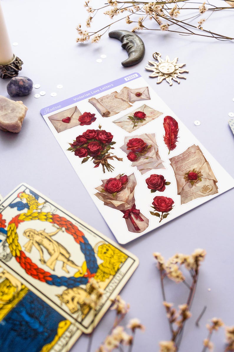 May include: A sheet of stickers featuring Victorian-era love letters, roses, and a feather. The stickers are on a white background with a light purple border. The text "Victorian Love Letters" is printed on the sheet.