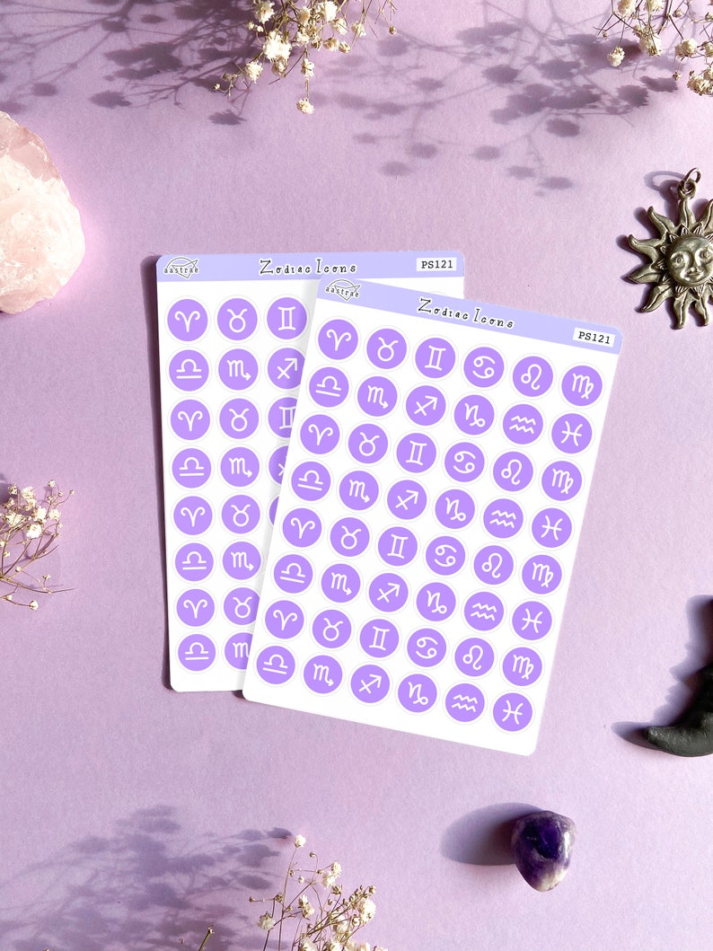May include: Two sheets of purple sticker paper with white circle stickers featuring the zodiac signs. The stickers are labeled "Zodiac Icons" and "PS121".