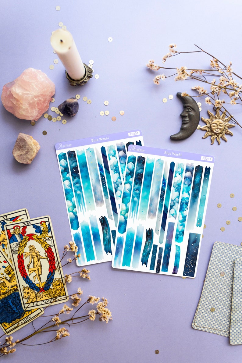 May include: Two sheets of blue and white washi tape with a starry sky and cloud design. The sheets are labeled "Blue Washi" and "PS2311".