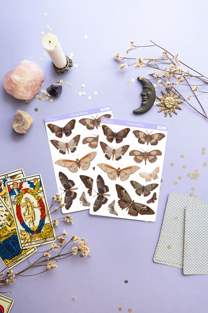 May include: Two sheets of vintage moth stickers with brown and white moths on a light purple background. The stickers are labeled "Vintage Moths" and have the product number "PS461".