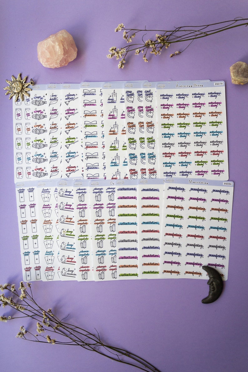May include: A set of 10 sheets of colorful planner stickers with various witchy themes. The stickers feature illustrations of candles, books, crystals, tarot cards, and more. The text on the stickers includes phrases like "spell", "manifest", "meditation", and "change crystals".