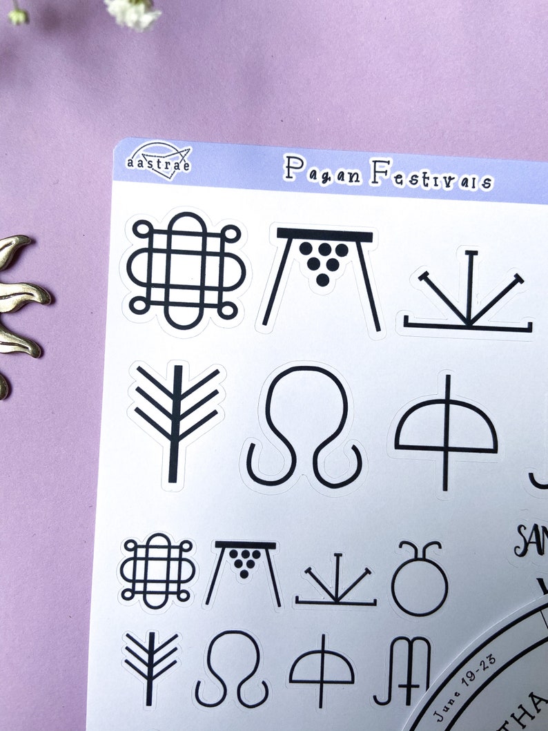 May include: A sheet of stickers with black and white illustrations of pagan festival symbols. The symbols include a circle with a knot, a table with grapes, a three-pronged fork, a tree, a sideways infinity symbol, an umbrella, a circle with a dot, and a sideways M. The text "Pagan Festivals" is at the top of the sheet.