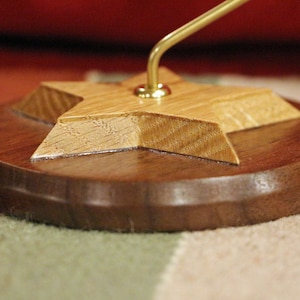 BS192 – A 4-1/2” Diameter Star Shaped Display Stand. Oak over Walnut.  Buyer selects the support rod material and height in the variations.