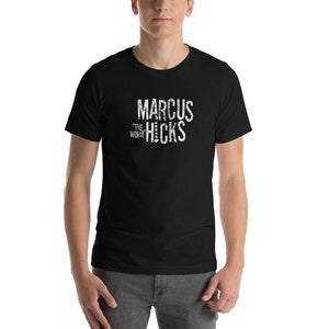 May include: Black t-shirt with white text that reads "Marcus "The Worm" Hicks"