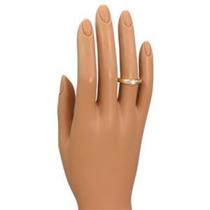 May include: A gold band ring with a single round diamond set in the center. The ring is on a white background.