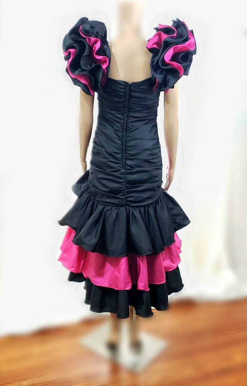 black dress with ruffles in front