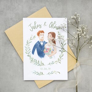 May include: A wedding invitation with a watercolor illustration of a couple in a wreath of greenery. The text reads "Jules & Alina" and "13.06.19".