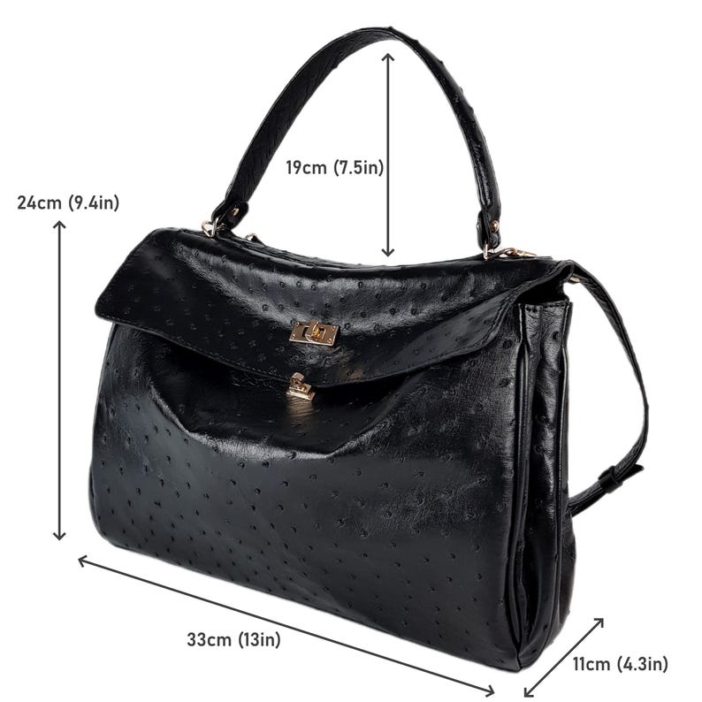 May include: Black handbag with a textured surface, a top handle, and a flap closure. The bag measures 13 inches wide, 9.4 inches high, and 4.3 inches deep, with a handle height of 7.5 inches.