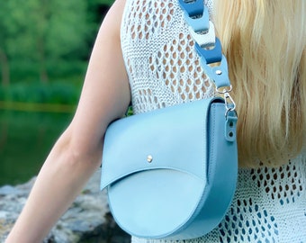 Light blue phone pouch with shoulder strap