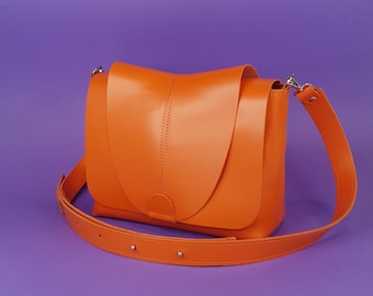 Available in 17 colors! Orange crossbody with flap, bag with wide shoulder strap, orange crossbody purse