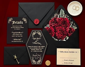 May include: A collection of black wedding invitations with gold accents. The invitations include a coffin-shaped card, envelopes, and a reply card. The envelope features a red wax seal. The invitation details are printed in gold script.