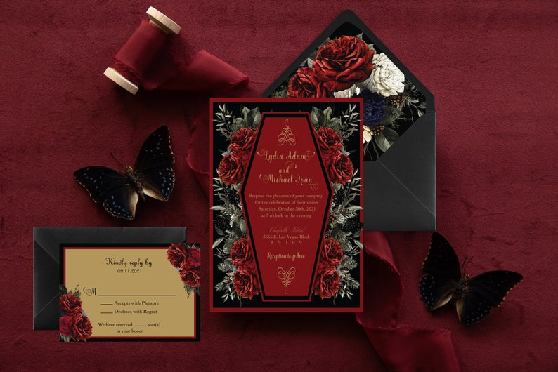 May include: A gothic wedding invitation with a black and red color scheme. The invitation features a coffin-shaped design with red roses and gold lettering. The text on the invitation reads "Lydia Adams and Michael Dean".