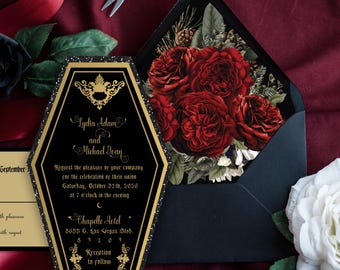May include: Black and gold wedding invitation in the shape of a coffin with the text "Lydia Adam and Michael Dean" and details about the wedding ceremony and reception.