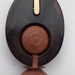 Contemporary necklace, carved, turned in Wengé wood, heather inlay, heather assembly and brass rod on leather cord