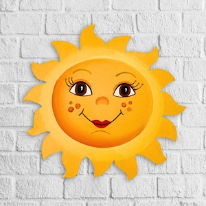 Puede incluir: Un sol amarillo con una cara sonriente, ojos marrones y labios rosados. El sol tiene un fondo de pared de ladrillo blanco.