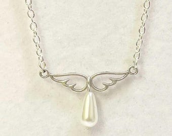 Silver wings and glass bead pendant on a silver plated chain Handmade