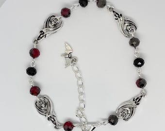 Hanging bat bracelet with black and red glass beads Handmade