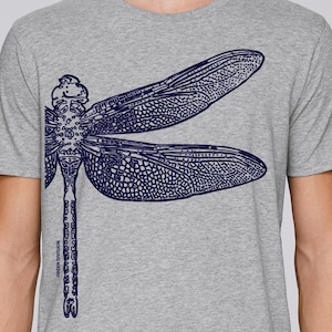 May include: A heather grey t-shirt with a navy blue dragonfly graphic print.