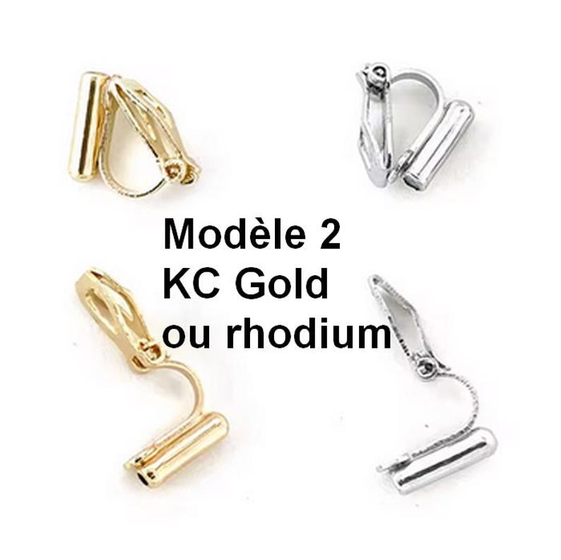 May include: Four metal clip-on earring converters in gold and silver tones. The components feature a cylindrical tube attachment and a hinged clip mechanism. Text in the centre reads: Mod&egrave;le 2 KC Gold ou rhodium.