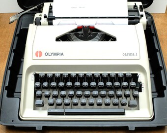 Vintage travel typewriter in case OLYMPIA CARINA 1 light grey light grey 70s