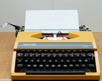 Vintage travel typewriter in case SILVER-REED IDOL made in Japan yellow 70s