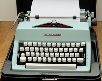 Vintage typewriter in case OLYMPIA COLORTIP S pastel mint green turquoise 60s