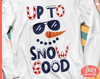 May include: White long-sleeve shirt with a snowman graphic. The design includes the text "UP TO SNOW GOOD" in red, white, and navy blue. The snowman has sunglasses and a carrot nose. A fun winter-themed shirt.