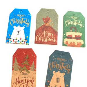 X 50 étiquettes cadeau "Merry Christmas", 5x3 cm, 5 visuels de Noel différents, carton, perforées, emballage et décorations  paquets cadeau