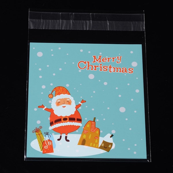 50 Sachets " Merry Christmas" bleu ciel  , cellophane à rabat autocollants, Motifs Père Noel et neige sur ciel bleu.