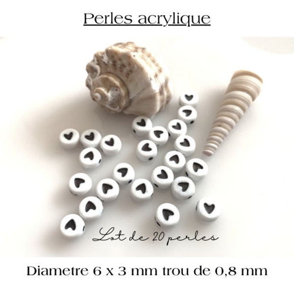 Perles acrylique 6 mm, ronde avec un petit coeur noir, 6 x 3mm, trou de 0.8 mm