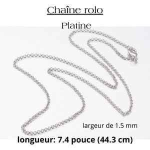 May include: A silver rolo chain necklace made of platinum. The chain is 7.4 inches (44.3 cm) long and 1.5 mm wide.