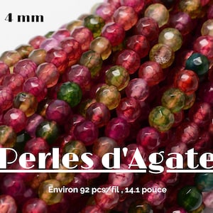 May include: A strand of 4 mm agate beads in shades of red, green, and brown. The beads have a faceted, irregular shape and a translucent appearance. The text "Perles d'Agate" and "Environ 92 pcs/fil, 14.1 pouce" is visible in the image.