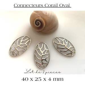Op de afbeelding: Een set van twee zilveren ovale connectoren met een delicaat takkenontwerp. De connectoren meten 40 x 25 x 4 mm. Lot de 2 pieces.