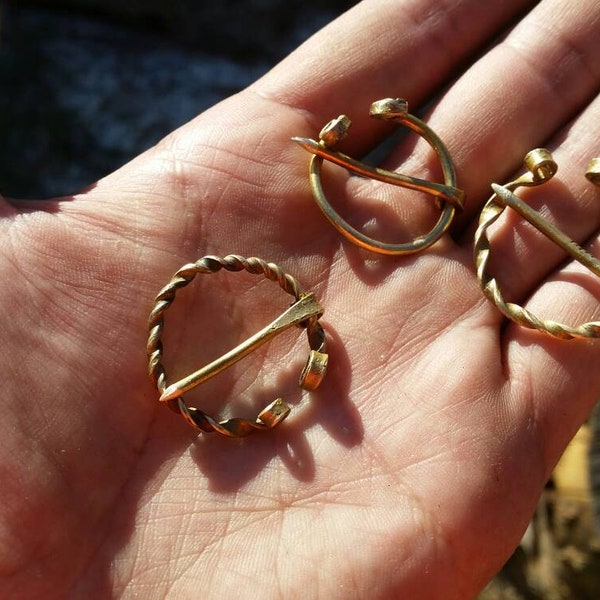 Set of 3  brass viking fibulas. Two types