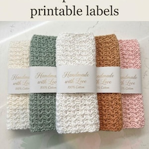 May include: Five rectangular crochet washcloths in cream, sage green, white, tan, and light pink. Each cloth features a textured star stitch pattern and a white paper label printed with the text Handmade with Love and 100% Cotton.