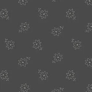 May include: Dark grey fabric featuring a repeating pattern of small, light grey floral designs. Each flower has multiple petals and is accompanied by a thin stem and leaves, creating a delicate, all-over print.