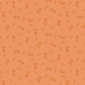 May include: Peach-coloured fabric featuring a repeating pattern of small, light brown floral and leaf motifs. The design includes scattered sprigs and clusters of tiny flowers, creating a delicate, all-over print suitable for various craft projects.